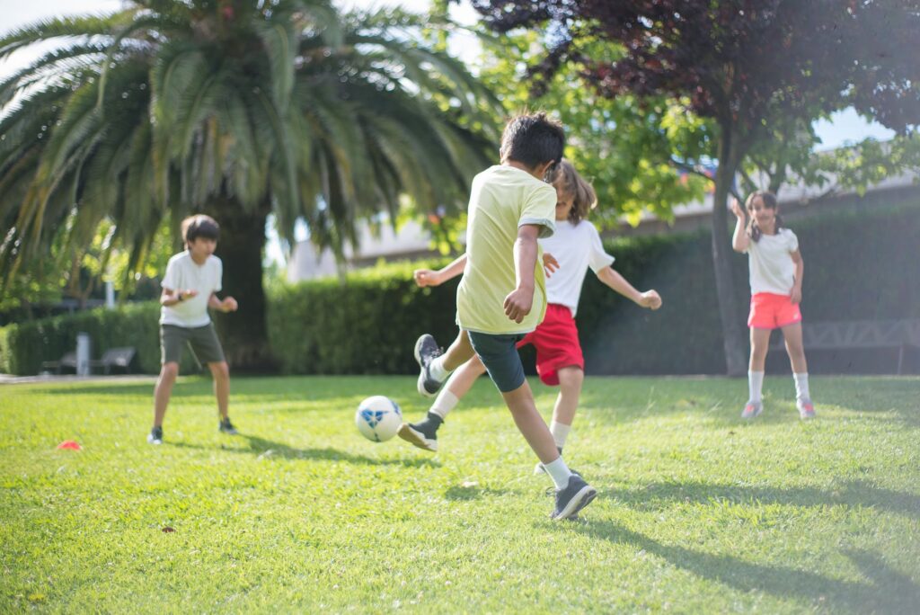 kids playing football on the field
